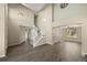 Bright, open-concept living room featuring high ceilings and updated flooring at 5010 Apache Creek Rd, Castle Rock, CO 80109