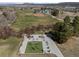 Aerial view of park featuring exercise equipment, baseball field and walking trail in a tranquil, green space at 5010 Apache Creek Rd, Castle Rock, CO 80109