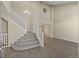 Open floorplan with a large staircase and updated flooring throughout at 5010 Apache Creek Rd, Castle Rock, CO 80109