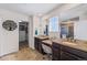 En-suite bathroom featuring double vanities, granite countertops, and a walk-in closet at 26304 E 4Th Pl, Aurora, CO 80018