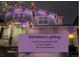 Two-story home exterior displaying multi-colored Gemstone lighting for the 4th of July at 26304 E 4Th Pl, Aurora, CO 80018