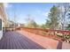 Wide wooden deck with a railing showcasing backyard and neighborhood views at 6997 S Poplar Way, Centennial, CO 80112