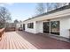 Large wooden deck overlooking the backyard with sliding glass doors into the home at 6997 S Poplar Way, Centennial, CO 80112