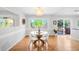 Elegant dining room featuring hardwood floors, modern lighting, and a stylish table setting at 6997 S Poplar Way, Centennial, CO 80112