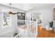 Inviting entryway with hardwood floors, elegant staircase, and modern lighting fixtures at 6997 S Poplar Way, Centennial, CO 80112