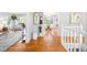 Spacious entryway featuring hardwood floors, open layout, and stylish decor at 6997 S Poplar Way, Centennial, CO 80112