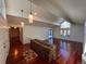 Spacious living room with hardwood floors and stone feature wall at 3 Columbine Ln, Littleton, CO 80123