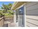 Balcony with wood deck and railings, with sliding glass doors at 1470 S Quebec Way # 244, Denver, CO 80231