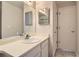 Bathroom sink with a door to the side featuring a mirror above the sink at 1470 S Quebec Way # 244, Denver, CO 80231