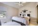 Comfortable bedroom with vaulted ceiling, a ceiling fan, and a cozy atmosphere at 1470 S Quebec Way # 244, Denver, CO 80231