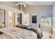 Bright bedroom with natural light, access to the ensuite bathroom and closet at 1470 S Quebec Way # 244, Denver, CO 80231