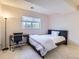 Bedroom featuring a bed and an office area near a window at 1470 S Quebec Way # 244, Denver, CO 80231
