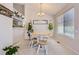 Inviting dining room with natural light, wood table, and cozy decor, ideal for intimate meals at 1470 S Quebec Way # 244, Denver, CO 80231