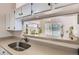 Kitchen counter featuring pass-through to the dining room and plants at 1470 S Quebec Way # 244, Denver, CO 80231