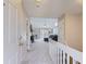 Hallway leading into an open-concept living room with natural light at 1470 S Quebec Way # 244, Denver, CO 80231