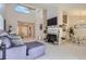 Bright open-concept living and dining room area with vaulted ceilings at 1470 S Quebec Way # 244, Denver, CO 80231
