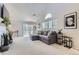 Bright living room with high ceilings, ceiling fan, and modern decor at 1470 S Quebec Way # 244, Denver, CO 80231