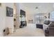 Open-concept living room featuring a vaulted ceiling and fireplace at 1470 S Quebec Way # 244, Denver, CO 80231