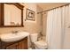 Traditional bathroom featuring vanity with sink, toilet and shower-tub combination at 4832 E Kentucky Ave # E, Denver, CO 80246