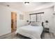 Relaxing bedroom features plush bedding and natural light at 4832 E Kentucky Ave # E, Denver, CO 80246