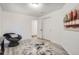 Bright bedroom with a comfortable papasan chair, closet, and light gray laminate wood flooring at 4832 E Kentucky Ave # E, Denver, CO 80246