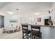 Bright kitchen area with a breakfast bar and stainless steel appliances at 4832 E Kentucky Ave # E, Denver, CO 80246