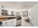 Bright kitchen with white cabinets, stainless appliances, and an eat-in dining space at 4832 E Kentucky Ave # E, Denver, CO 80246