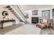 Bright living room with staircase, fireplace, and modern decor at 4832 E Kentucky Ave # E, Denver, CO 80246