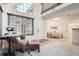 Open concept living room featuring high ceilings, large windows, and neutral tones at 4832 E Kentucky Ave # E, Denver, CO 80246