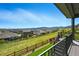 Scenic backyard view from the deck overlooking lush greenery and the neighborhood at 18212 W 95Th Pl, Arvada, CO 80007