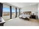 Bright and spacious bedroom with large windows showcasing picturesque neighborhood views at 18212 W 95Th Pl, Arvada, CO 80007