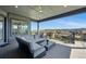 Relaxing outdoor deck area with comfortable lounge seating and neighborhood views at 18212 W 95Th Pl, Arvada, CO 80007