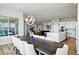 Open dining room with a large table, stylish lighting, and lots of seating at 18212 W 95Th Pl, Arvada, CO 80007