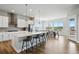 Open concept kitchen with stainless steel appliances and a large island perfect for entertaining at 18212 W 95Th Pl, Arvada, CO 80007