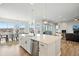 Open kitchen and dining area with mountain views at 18212 W 95Th Pl, Arvada, CO 80007