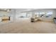 A spacious open-plan living room complete with a comfortable sofa and a fun zone at 18212 W 95Th Pl, Arvada, CO 80007