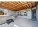 Covered patio features a hot tub, and overlooks backyard at 18212 W 95Th Pl, Arvada, CO 80007