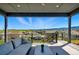 Relaxing covered deck with comfortable seating and stunning neighborhood views at 18212 W 95Th Pl, Arvada, CO 80007