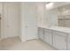 Beautiful bathroom with double sink vanity, white cabinets, and large mirror at 1818 Sawtooth Mountain Dr, Berthoud, CO 80513