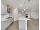 Modern kitchen featuring stainless steel appliances, gray cabinets, and a center island at 1818 Sawtooth Mountain Dr, Berthoud, CO 80513