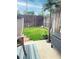 Serene backyard with lush green grass, a charming flowerbed, and a privacy fence at 8224 Washington St # 11, Denver, CO 80229