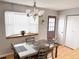 Bright dining room with a stylish table set and natural light at 8224 Washington St # 11, Denver, CO 80229