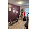 Home exercise room with motivational decor, updated floors, and a variety of equipment at 8224 Washington St # 11, Denver, CO 80229