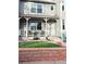 Charming home with a welcoming front porch, updated landscape, and a classic white railing at 8224 Washington St # 11, Denver, CO 80229