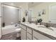 Stylish bathroom with double vanity, granite countertops, and tiled shower/tub combination at 12920 Jasmine St # F, Thornton, CO 80602