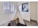 Cozy bedroom with natural light, a teepee, and a playful painting for a creative space at 12920 Jasmine St # F, Thornton, CO 80602