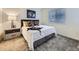 Comfortable bedroom with neutral tones, plush carpet, and window with natural light at 12920 Jasmine St # F, Thornton, CO 80602