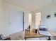 Bright bedroom featuring a work area with a desk, laptop, and neutral decor at 12920 Jasmine St # F, Thornton, CO 80602