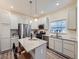 Modern kitchen featuring granite countertops, stainless steel appliances, and ample cabinet space for storage at 12920 Jasmine St # F, Thornton, CO 80602