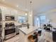 Eat-in kitchen boasts granite countertops, stainless steel appliances, and natural light at 12920 Jasmine St # F, Thornton, CO 80602